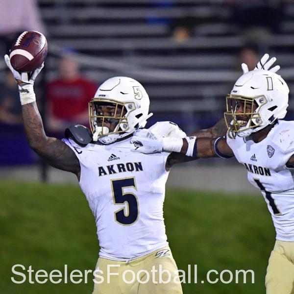 Akron Zips linebacker Ulysees Gilbert III (5) react after scoring a touchdown on a fumble recovery in the second half against the Northwestern Wildcats at Ryan Field. Mandatory Credit: Quinn Harris-USA TODAY Sports