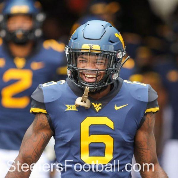 West Virginia Mountaineers safety Devon Askew-Henry runs onto the field before a game in 2018